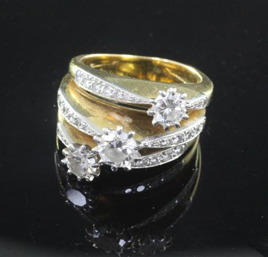 An 18ct gold and diamond triple band dress ring, size O.